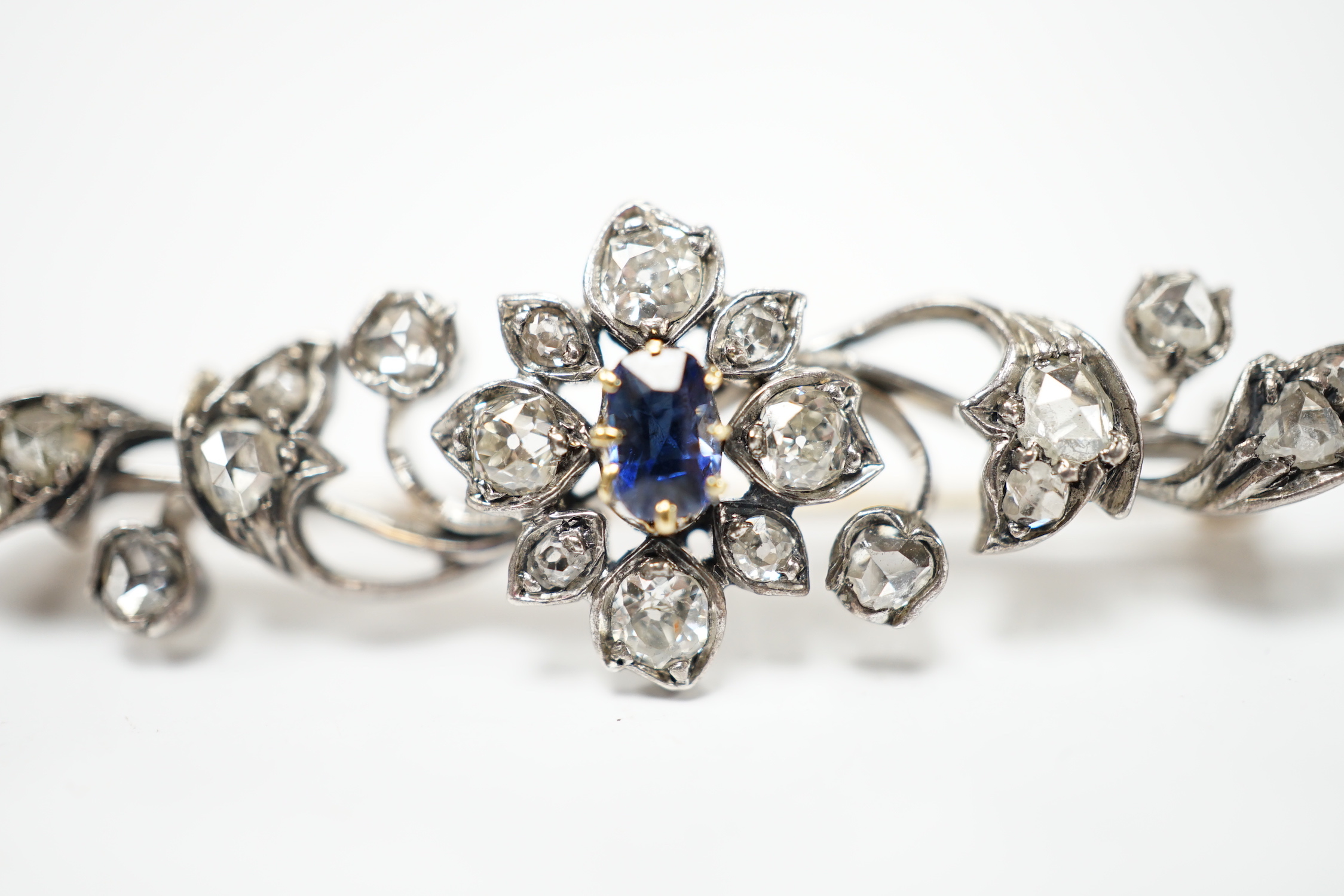 A late Victorian yellow and white metal, sapphire, old and rose cut diamond cluster set foliate brooch, 47mm, gross weight 4.3 grams.